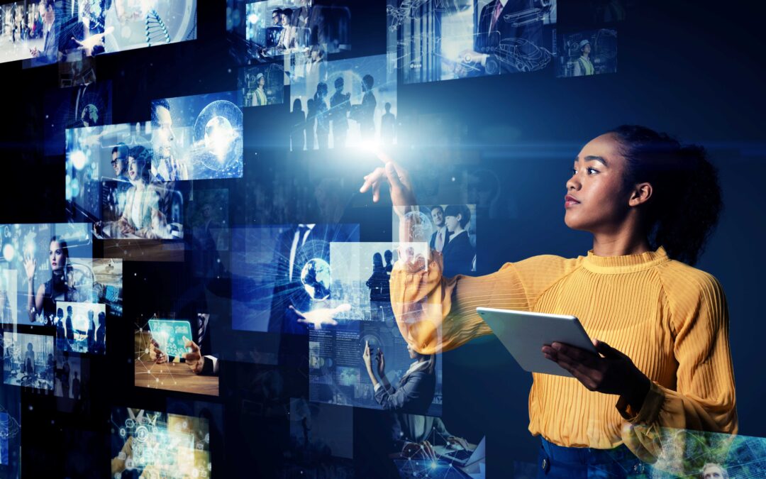 Woman holding a tablet computer and looking at photos stored in the Cloud.