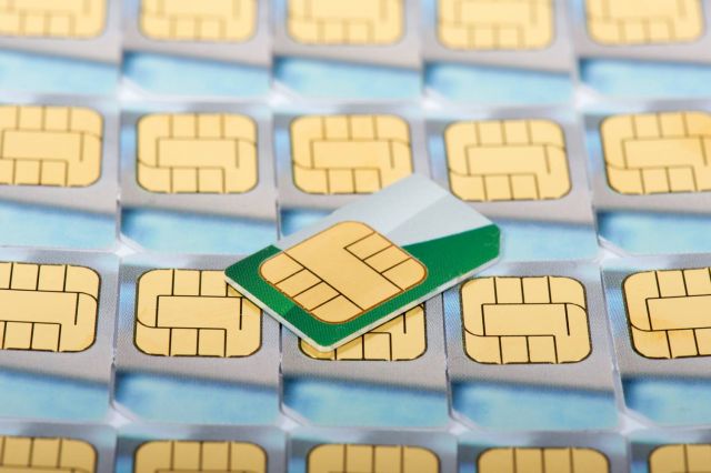 Rows of yellow cellphone sim cards.