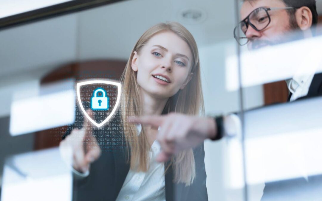 Businessman and woman touching data protection shield