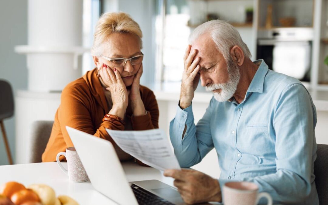 Couple reviewing a document due to concern about fraud