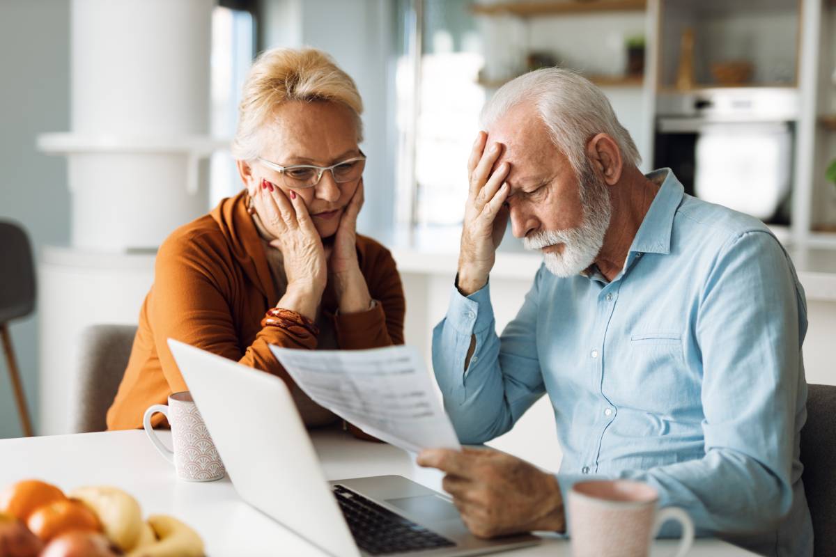 Couple reviewing a document due to concern about fraud