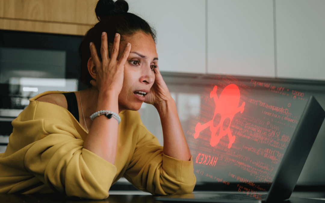 Woman distressed because she is getting a Hacked message on her desktop computer.