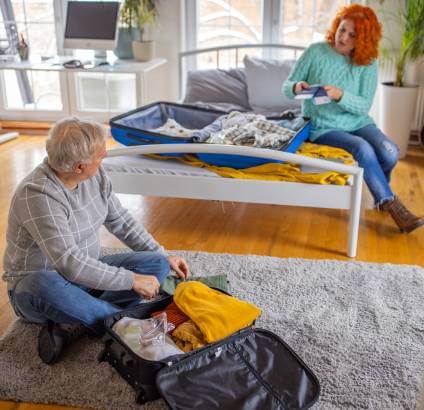 Couple unpacking after returning from vacation.