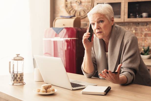 Woman talking on her phone to IDShield about a data brach.